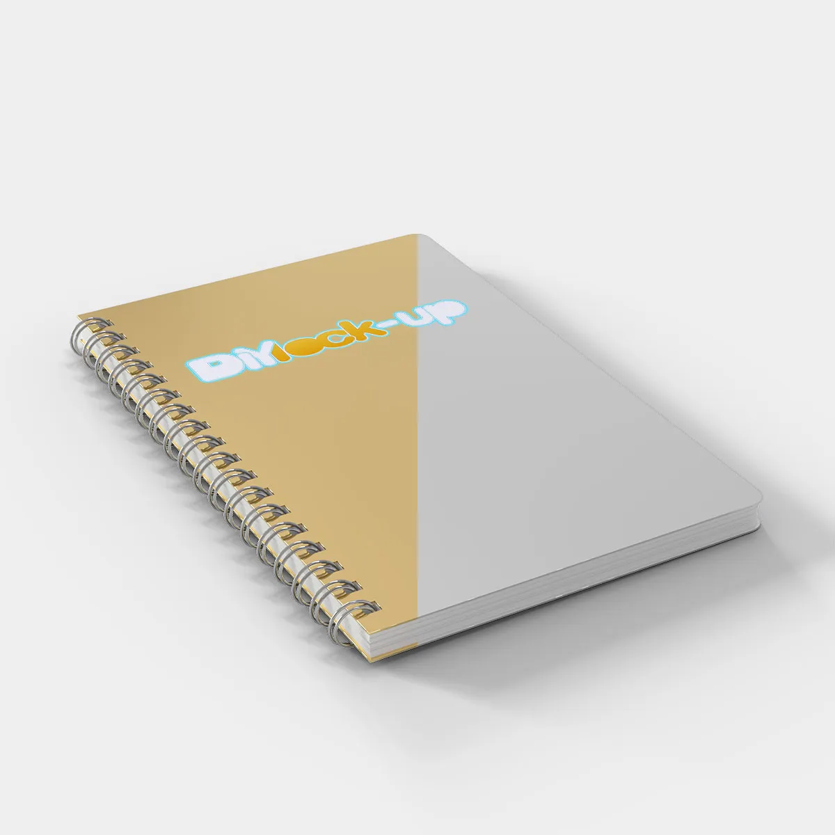gold silver notebook at a diagonal angle