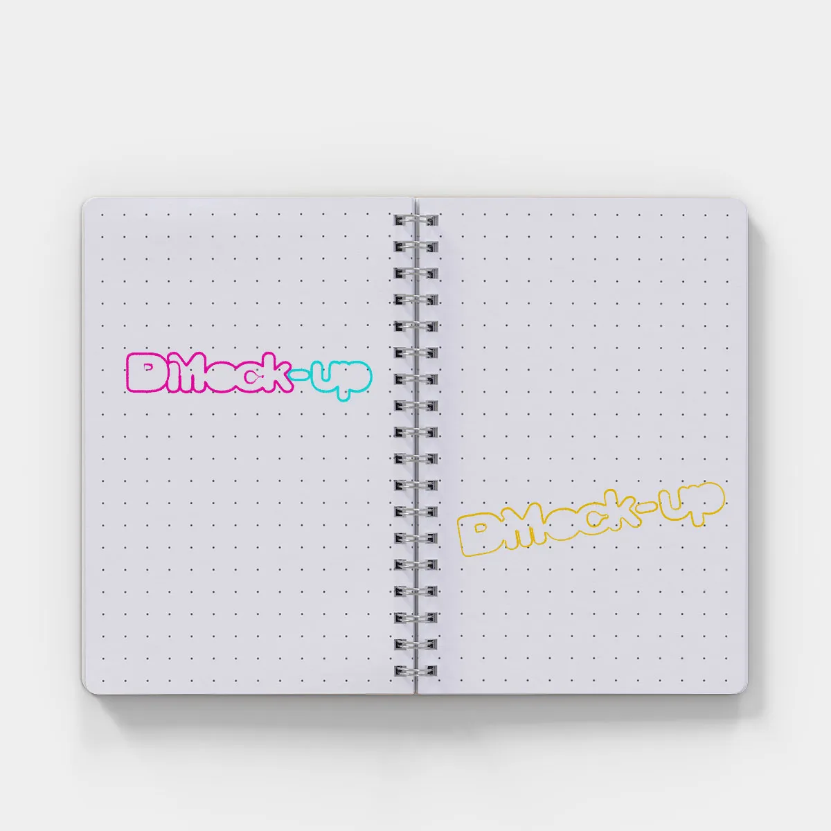 top view of a opened notebook with a dot grid pattern